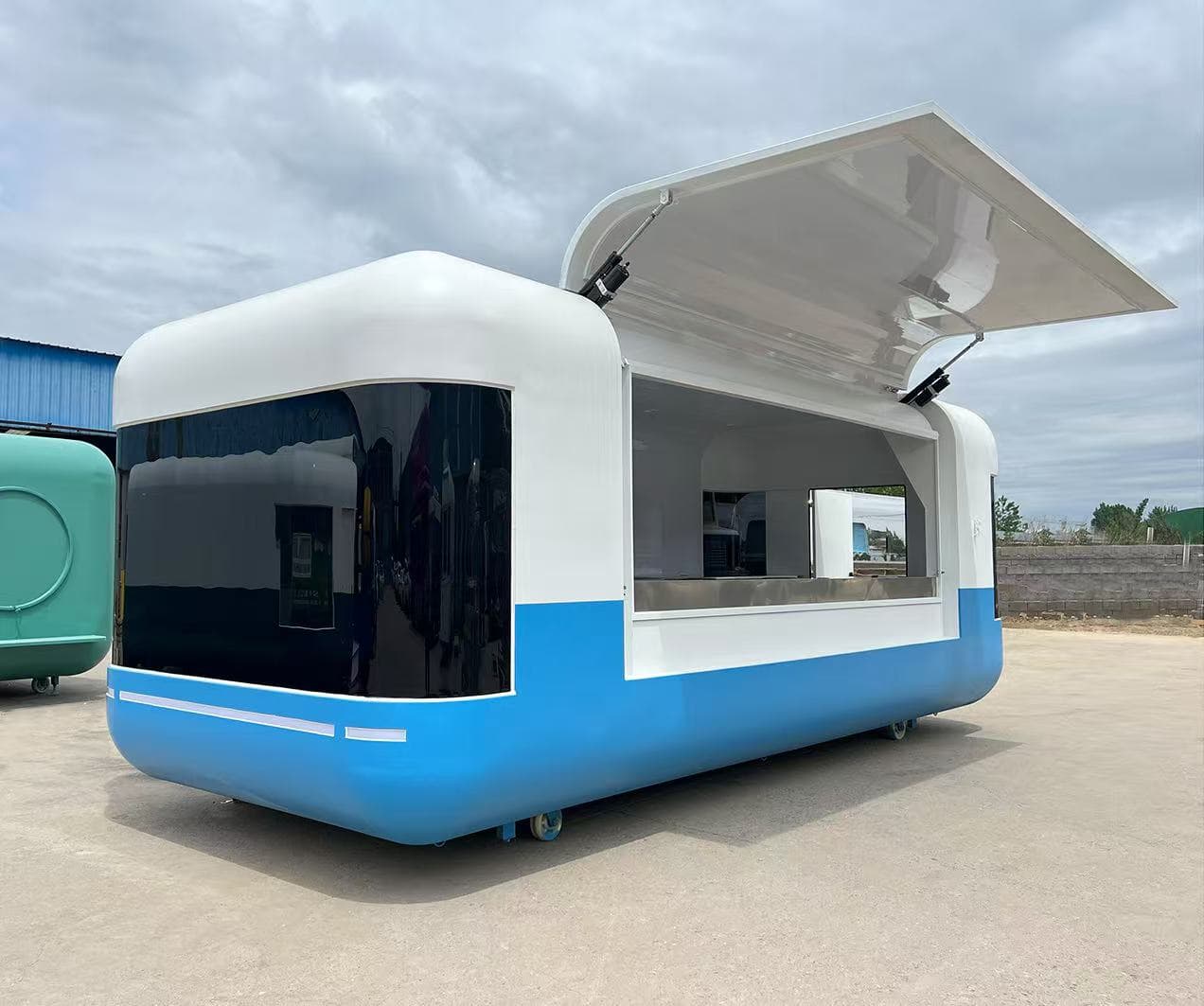 Blue-and-white Aero food truck at the factory